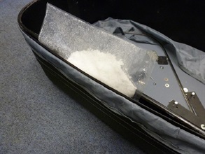 The Customs seized about two kilogrammes of methamphetamine hidden inside a false compartment of a suitcase.