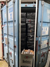 Hong Kong Customs yesterday (June 13) raided a large-scale storage centre in San Tin, Yuen Long, for suspected duty-not-paid cigarettes (commonly known as "cheap whites") and seized about 10.6 million suspected illicit cigarettes with an estimated market value of about $48 million and a duty potential of about $35 million. About 7.3 million suspected illicit cigarettes seized were "cheap whites", accounting for about 70 per cent of the total seizure. It was the largest case of "cheap whites" detected by Customs this year. Photo shows a container containing some of the suspected illicit cigarettes involved in the case.