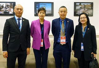 The Commissioner of Customs and Excise, Ms Louise Ho (second left), interacts with the Director General of the Singapore Customs, Mr Tan Hung Hooi (second right), during the 143rd/144th Sessions of the Customs Co-operation Council of the World Customs Organization.