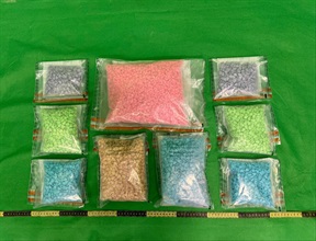 Hong Kong Customs on July 19 and 20 detected two incoming passenger drug trafficking cases at Hong Kong International Airport and seized a total of about 1 kilogram of suspected cocaine and 7kg of suspected 3,4-methylenedioxymethamphetamine (MDMA) with a total estimated market value of about $2 million. Photo shows the suspected MDMA seized by Customs officers in the second case.
