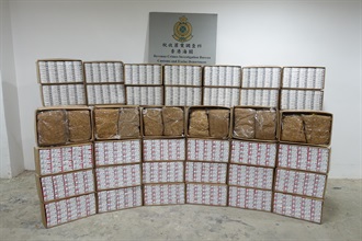 Hong Kong Customs yesterday (October 9) raided a suspected illicit cigarette and manufactured tobacco storage centre in Tsuen Wan and seized about 2.3 million suspected illicit cigarettes and about 280 kilograms of suspected duty-not-paid manufactured tobacco, with an estimated market value of about $12.3 million and a duty potential of about $8.8 million. Photo shows the suspected illicit cigarettes and duty-not-paid manufactured tobacco seized.