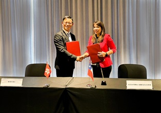 The Commissioner of Customs and Excise, Ms Louise Ho, from December 3 to 5, led a delegation to attend the 91st Session of the Policy Commission of the World Customs Organization in Cape Town, South Africa. Photo shows the Assistant Commissioner (Excise and Strategic Support) of Customs and Excise, Mr Rudy Hui (left) signing the Authorized Economic Operator Mutual Recognition Arrangement Action Plan with the Director General of National Customs Service of Chile, Ms Alejandra Arriaza Loeb (right) during the meeting.