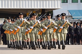 Hong Kong Customs Passing-out Parade was held today (December 17). Photo shows members of the Customs and Excise Department Guards of Honour performing an exhibition drill.